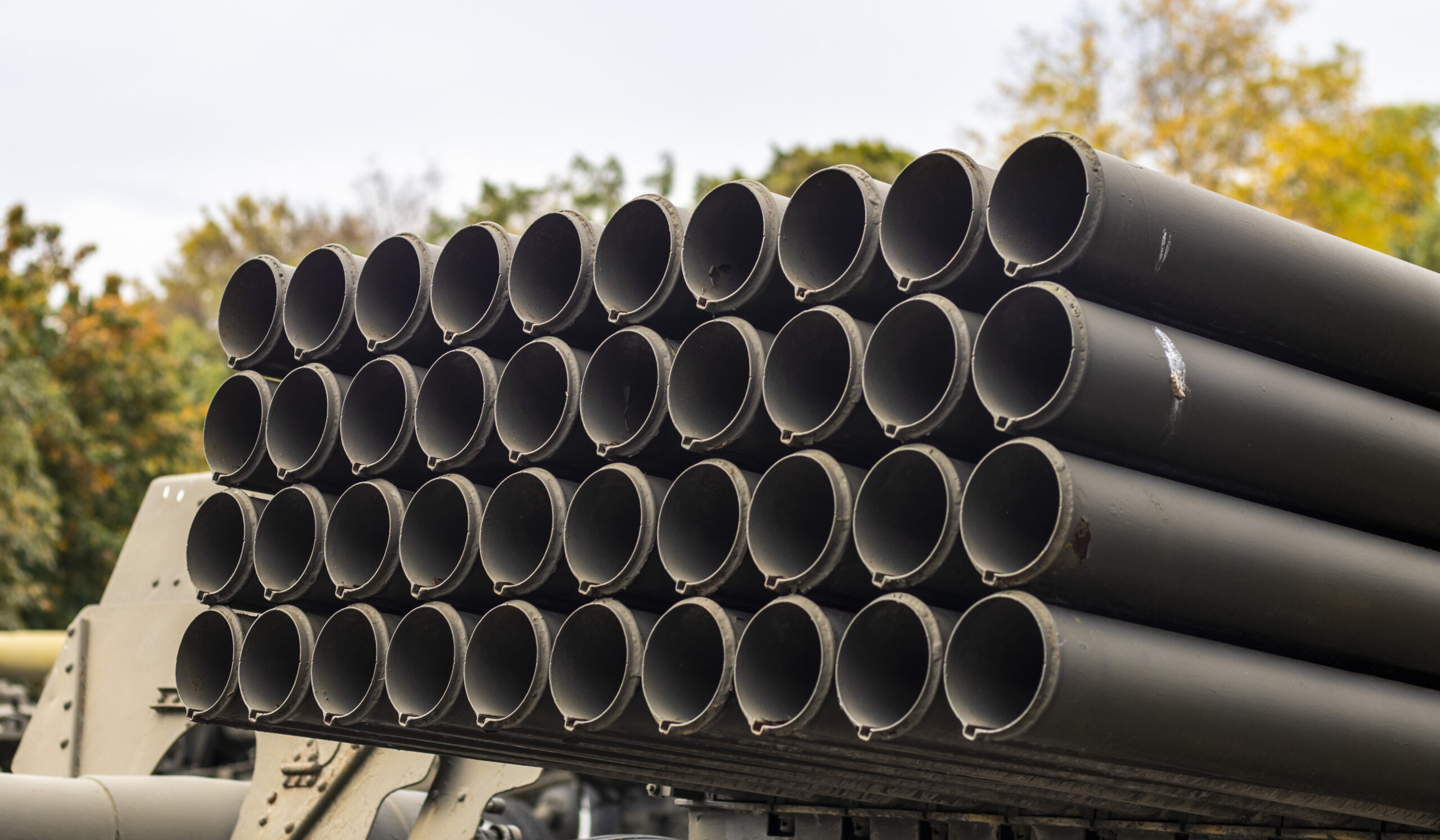 The old Soviet BM-21 Grad multiple launch rocket system on the chassis of a 375D truck. MLRS 9K51 caliber 122 mm close-up, rear fragment. Artillery mount of 40 empty tubular rails